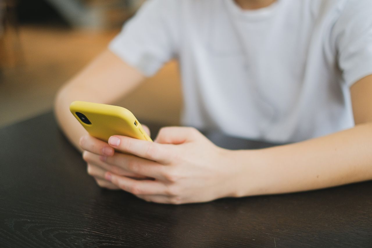 A person scrolling through their phone