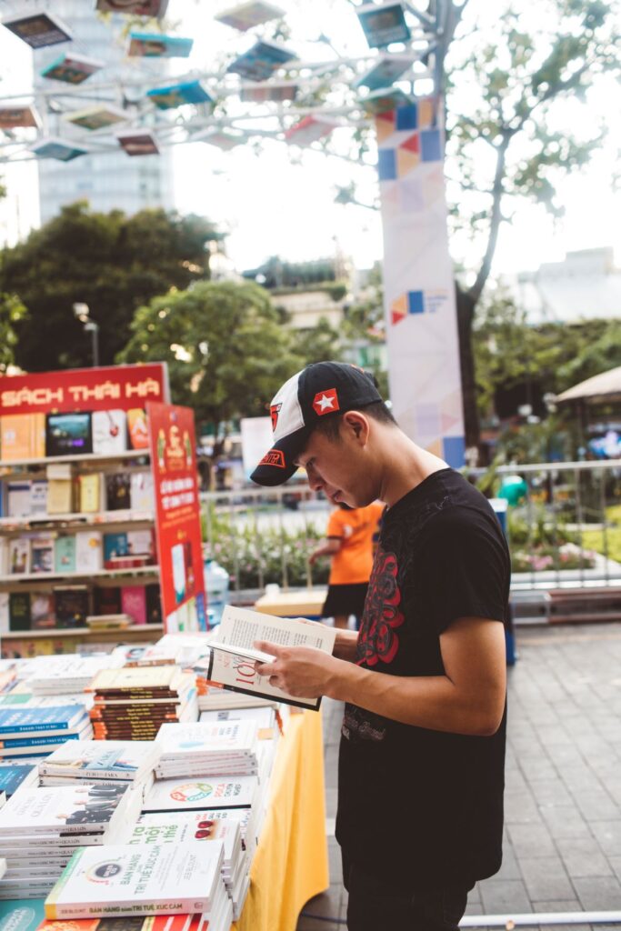 man reading books